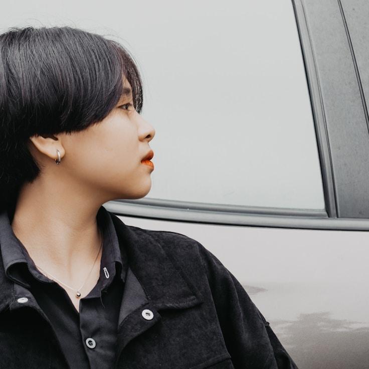 Kaveri Mehta, Lead Design Curator at GroveBenchStudio, reviewing corporate floral arrangements